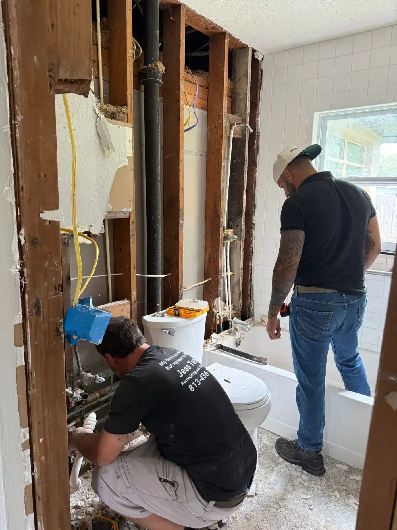 New plumbing supply lines and drain being set during the Wesley Chapel bathroom remodel