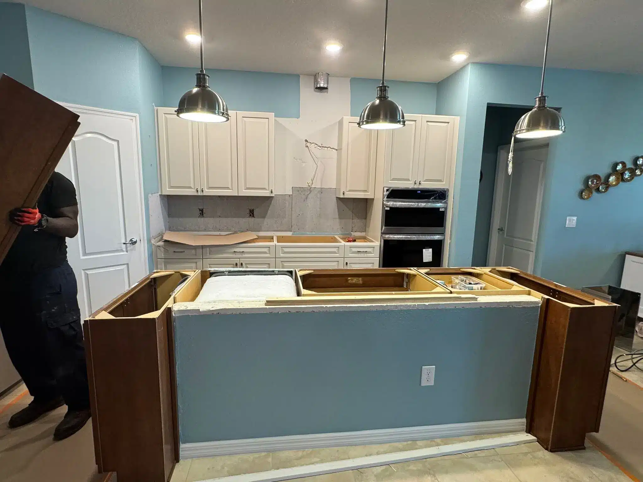 Brandon kitchen during the remodel, showing the island stripped ready for its new top