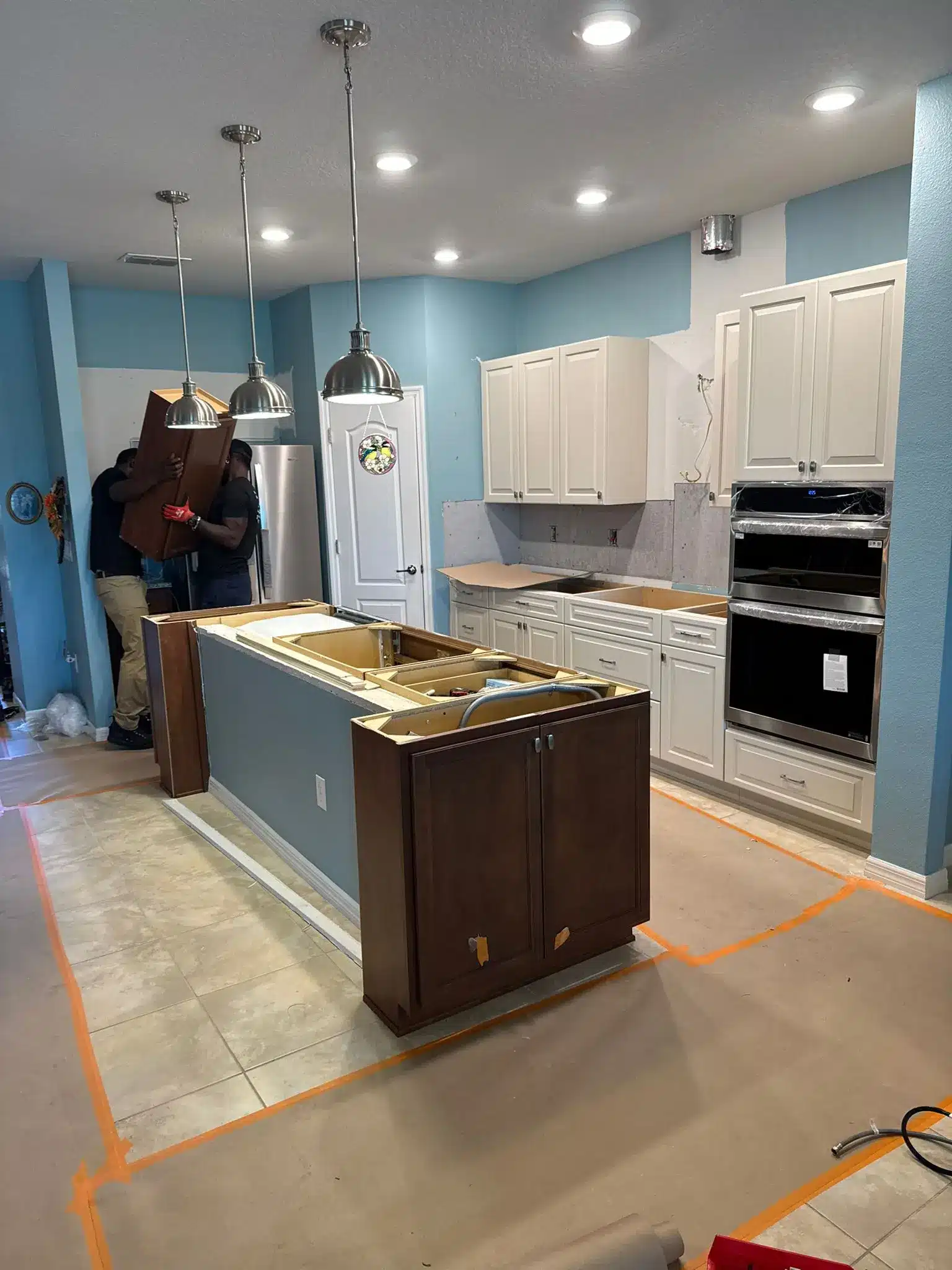 Brandon kitchen mid-remodel, with cabinetry being refinished and countertops removed